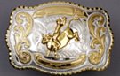 silver and gold tone rodeo bull rider western belt buckle