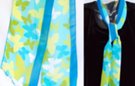 chiffon belt scarf, cloud of butterflies in shades of green, blue and white on an aqua blue field, royal blue border