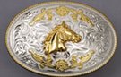 silver and gold tone horse head oval western belt buckle