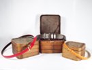red, orange, and brown leather belts with Chinese rattan boxes