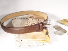 dress belt with abacus, coins and financial newspapers