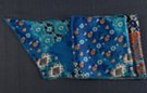 satin belt scarf, arrays of flowers overlaid with abstract husks  in shades of blue from aqua to midnight offset by copper and white