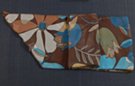 chiffon belt scarf, garden of big-petal flowers in blue, brown, olive and white against a dark brown background